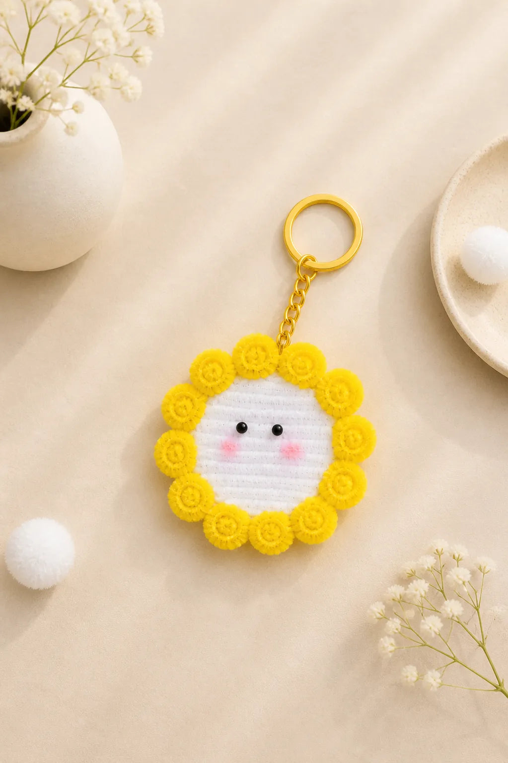 Cute smiley face handmade keychain with yellow flower border and soft pipe cleaner texture aesthetic product photo